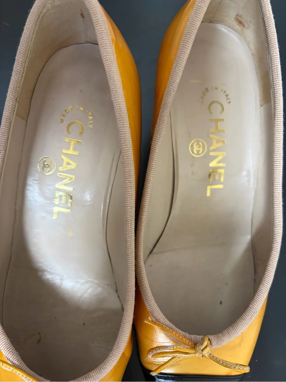 CHANEL Two-Tone Yellow and Black Leather Cap-Toe Ballet Flats